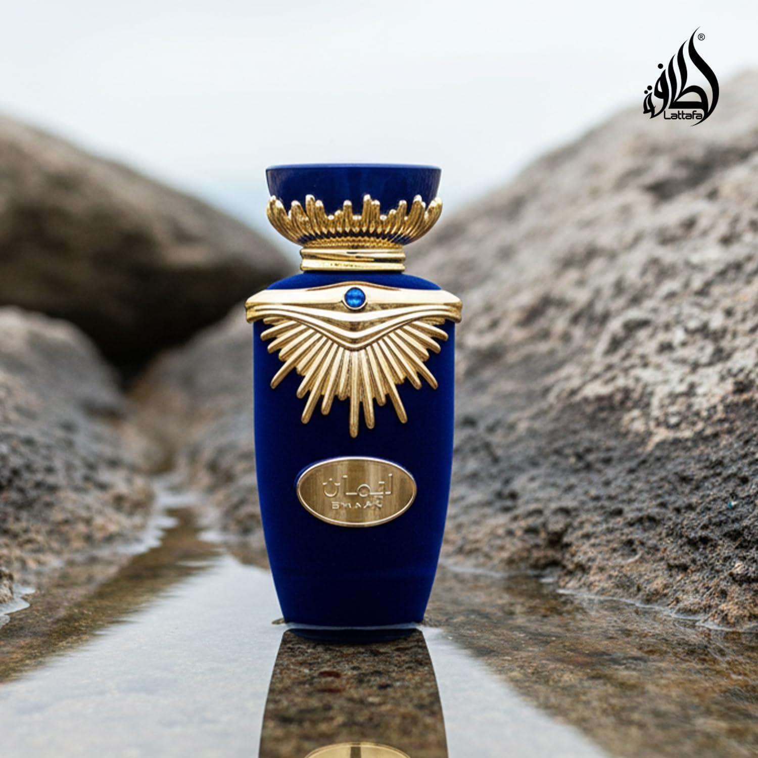 Lattafa Emaan bottle on wooden table evoking warm woody base and mood