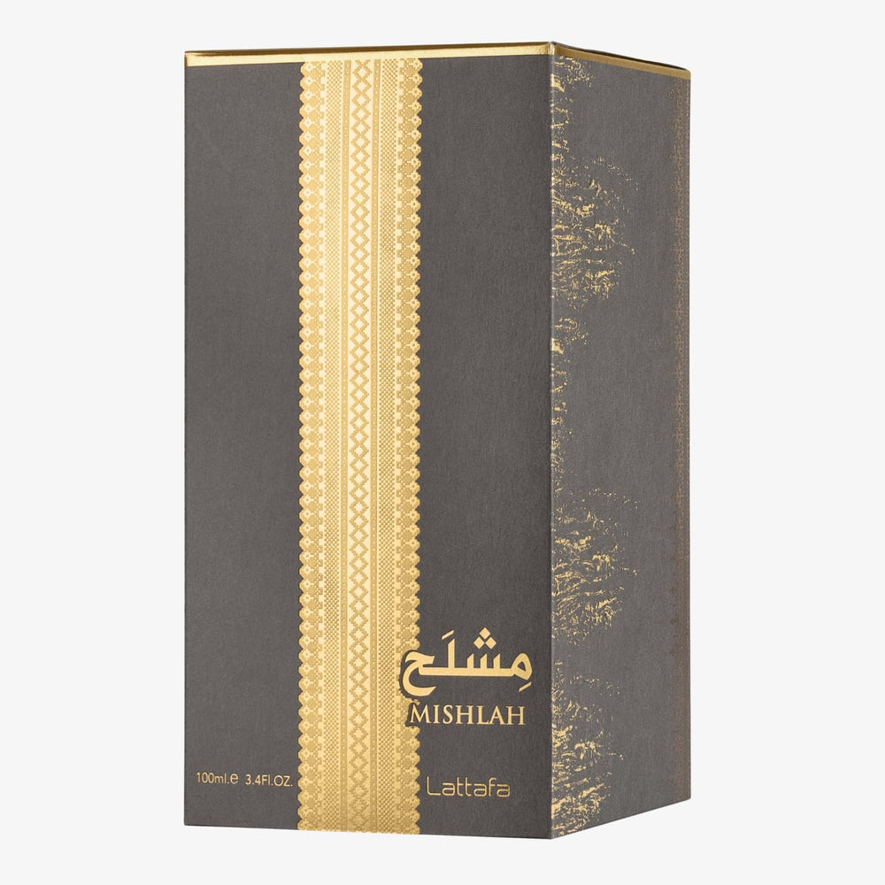 Lattafa Mishlah displayed on a vanity with accessories, suggesting refined everyday elegance