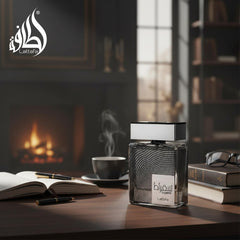 Lattafa Suqraat beside a ruler showing 100 ml size and travel-ready convenience