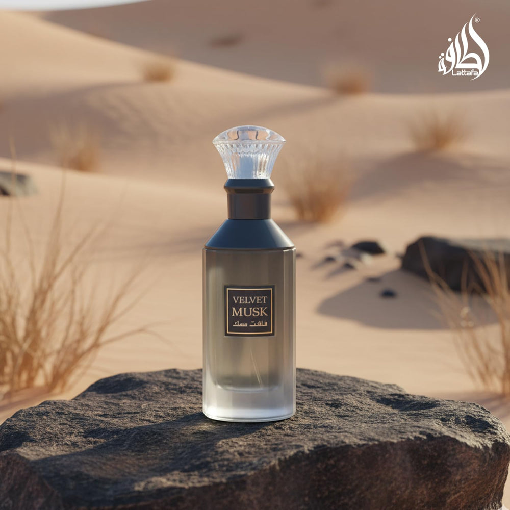 Lattafa bottle next to a ruler to show 100 ml scale and portability