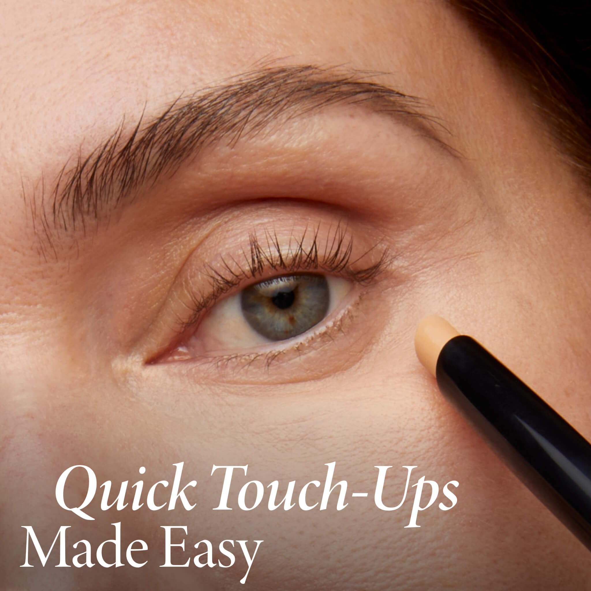 LAURA GELLER NEW YORK blending concealer with finger for seamless finish
