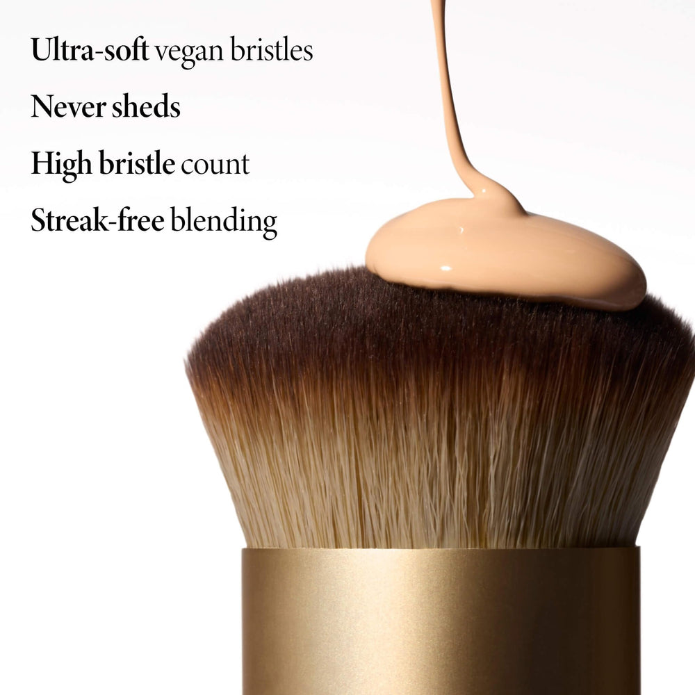 LAURA GELLER applying liquid foundation with brush for streak-free finish benefit