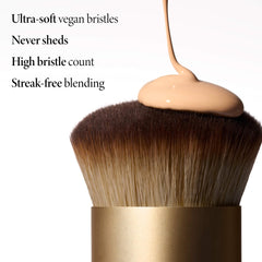 LAURA GELLER applying liquid foundation with brush for streak-free finish benefit