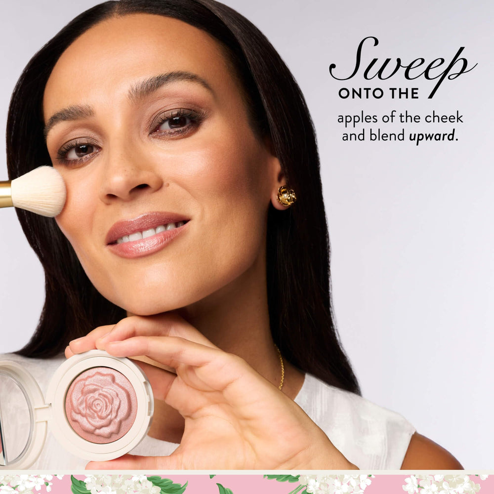 LAURA GELLER compact next to coin showing size and travel-friendly benefit