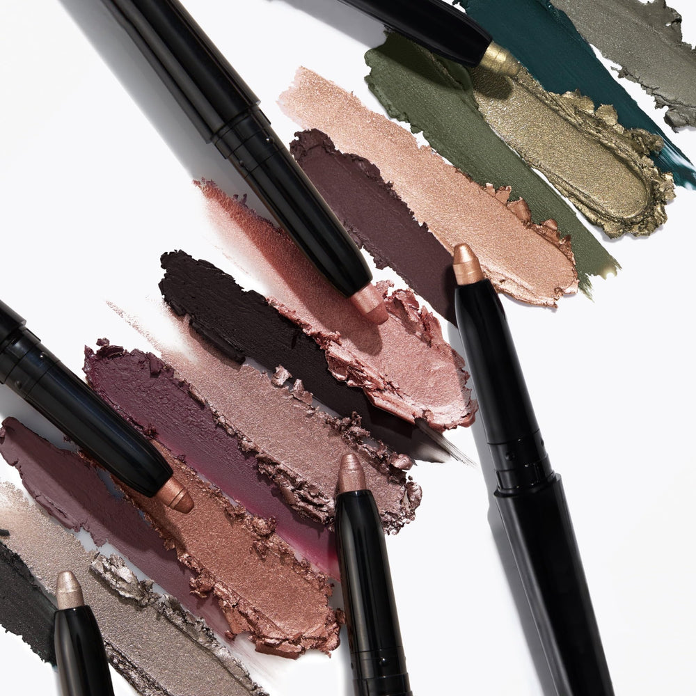 LAURA GELLER model applying shadow from stick demonstrating quick application benefit