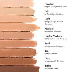 LAURA GELLER NEW YORK stick held in hand illustrating portable size and quick touch-up benefit