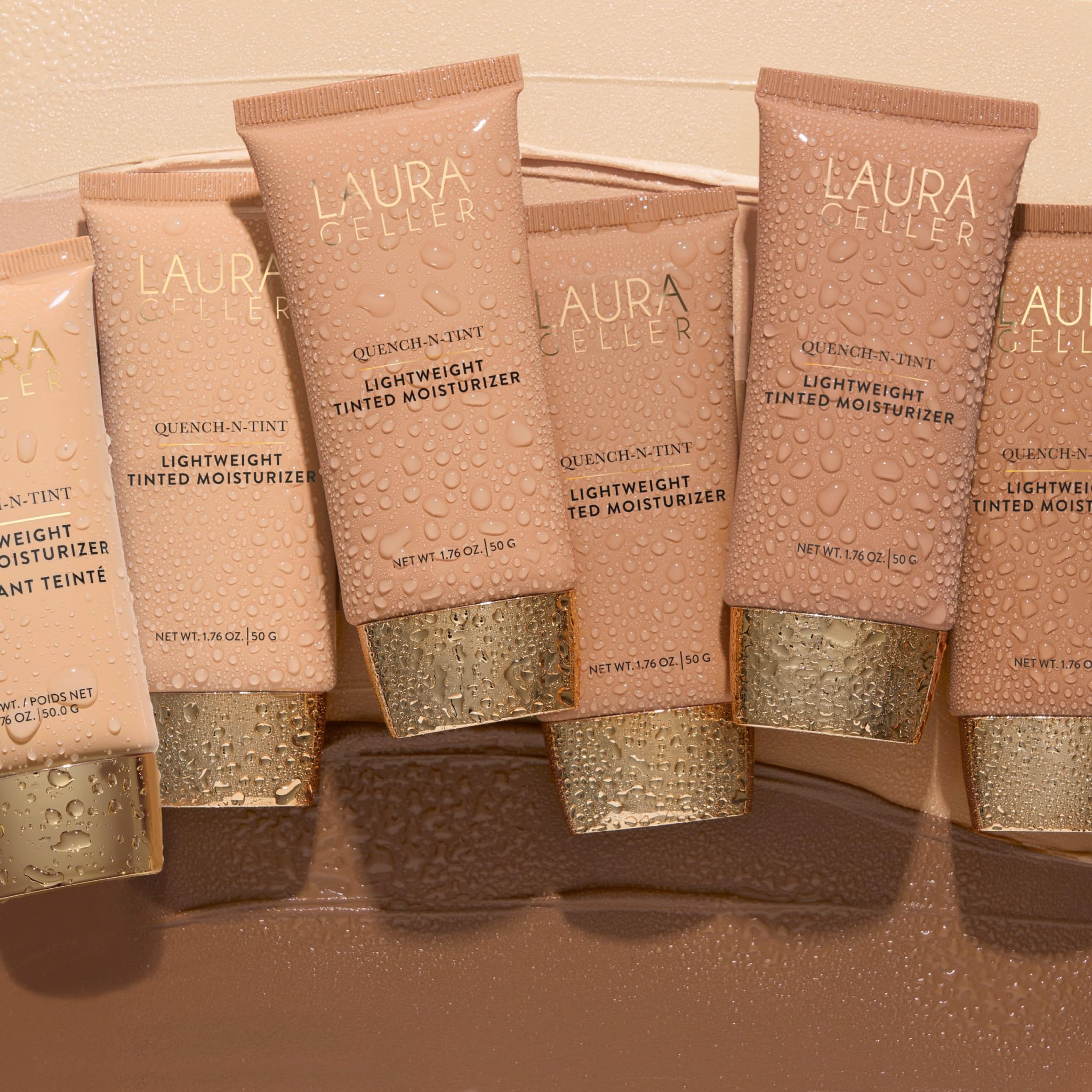 LAURA GELLER NEW YORK poured drop closeup highlighting hydrating, water-based formula
