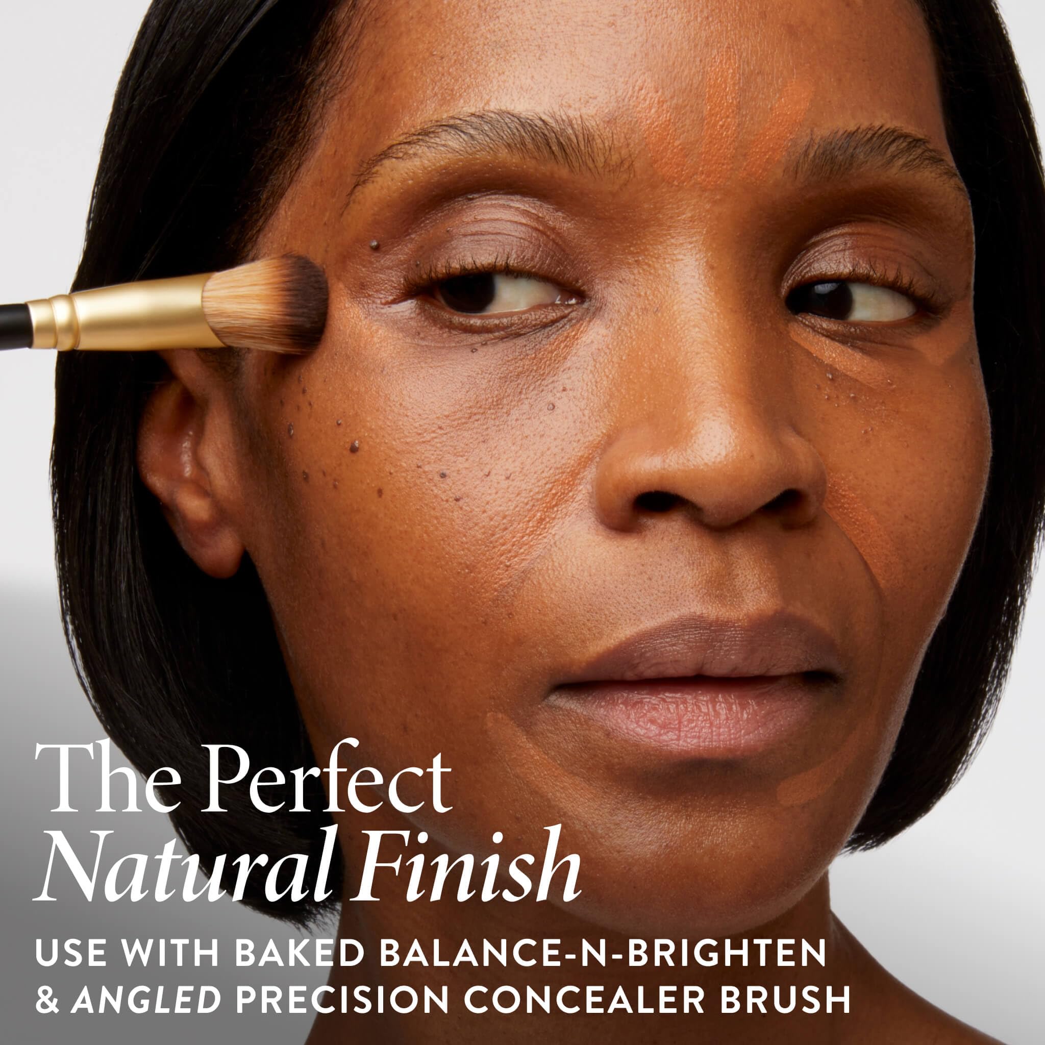 LAURA GELLER NEW YORK hand holding stick to show compact size benefit