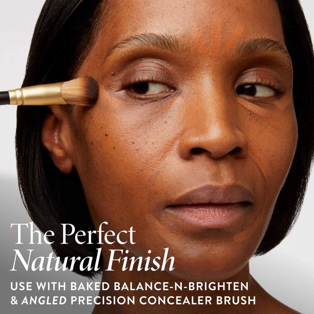 LAURA GELLER NEW YORK hand holding stick to show compact size benefit