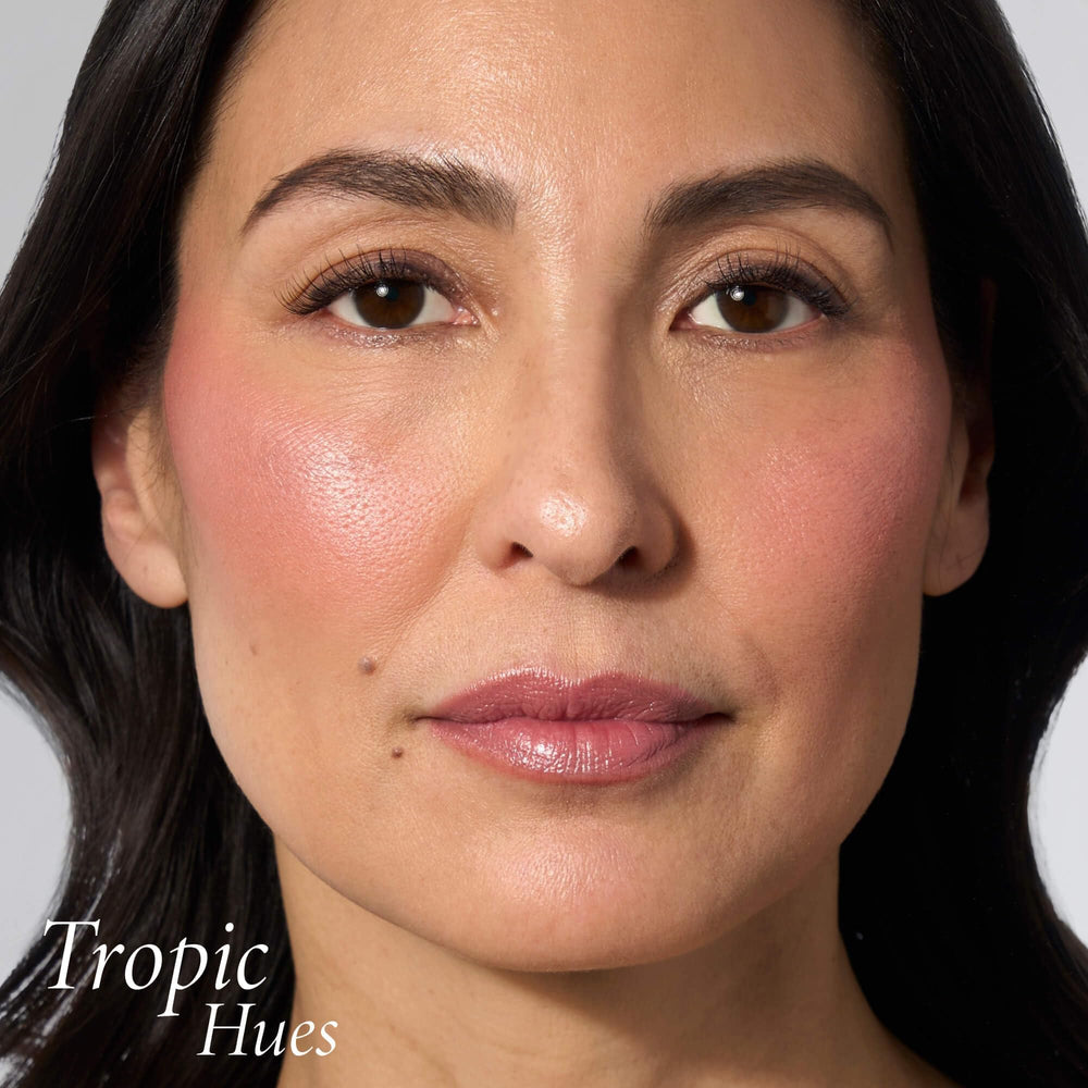 LAURA GELLER compact held in hand shows travel-friendly scale