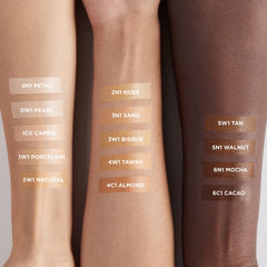 Laura Mercier 3N1 Sand swatches on arm illustrating buildable, natural coverage