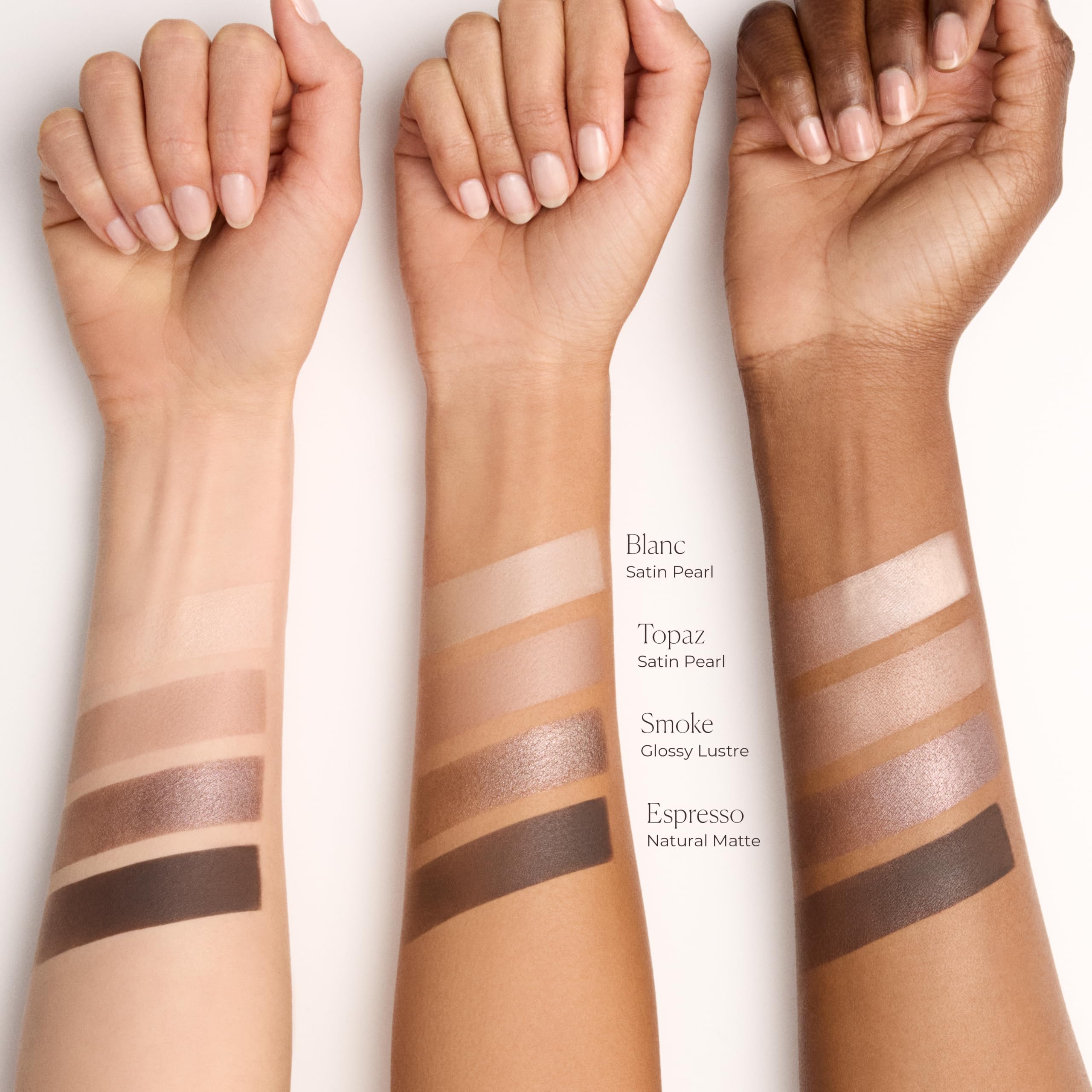 Laura Mercier swatches on arm illustrating creamy pigment and blendable finishes