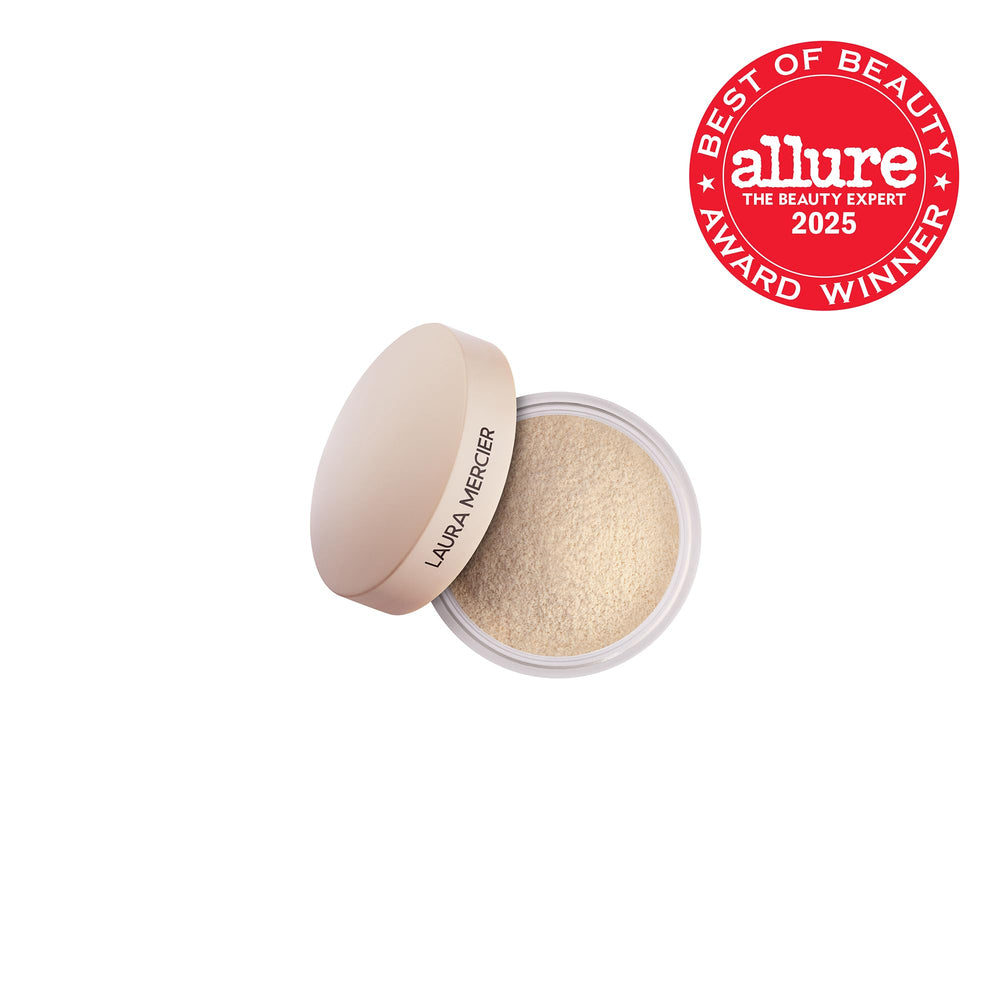 Laura Mercier open jar showing smooth powder texture and blur effect