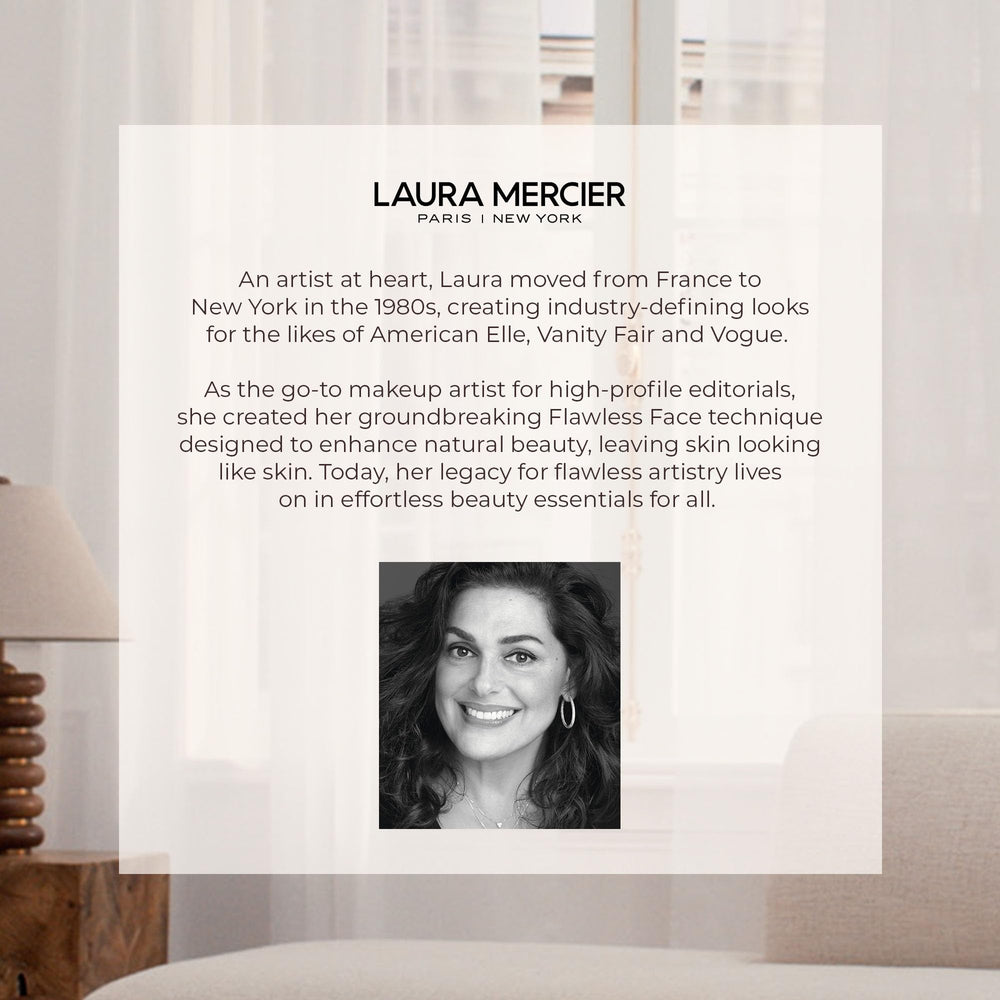 Laura Mercier brush held in hand to show size and control for precise application