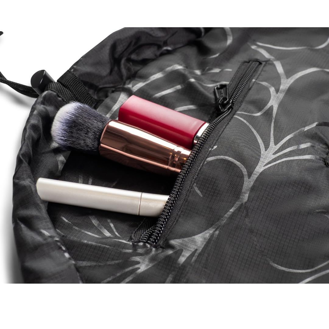 Lay-n-Go Cosmo folded and packed in a suitcase saving space benefit