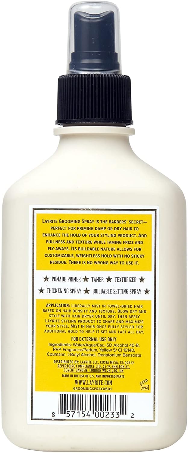 Layrite being sprayed by a barber onto client hair to add lift and control