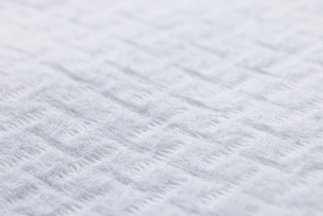 Le Visage certification label close-up showing OEKO‑TEX and GOTS assurances