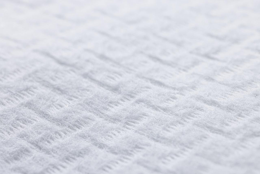 Le Visage certification label close-up showing OEKO‑TEX and GOTS assurances