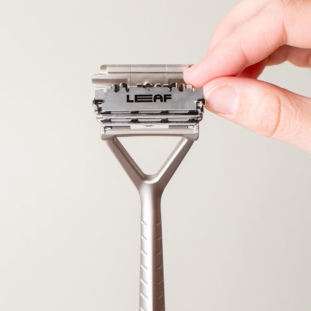 Leaf Shave blade installed in razor demonstrating easy replacement and reliable shave