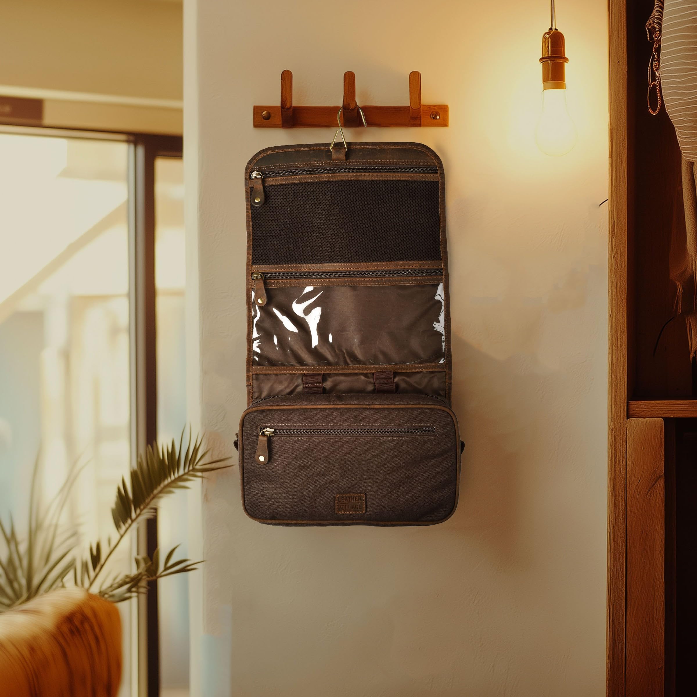 LEATHER VILLAGE size comparison beside passport and toothbrush showing travel-friendly scale