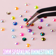 LERBOU applicator and tweezers positioned for precise rhinestone placement