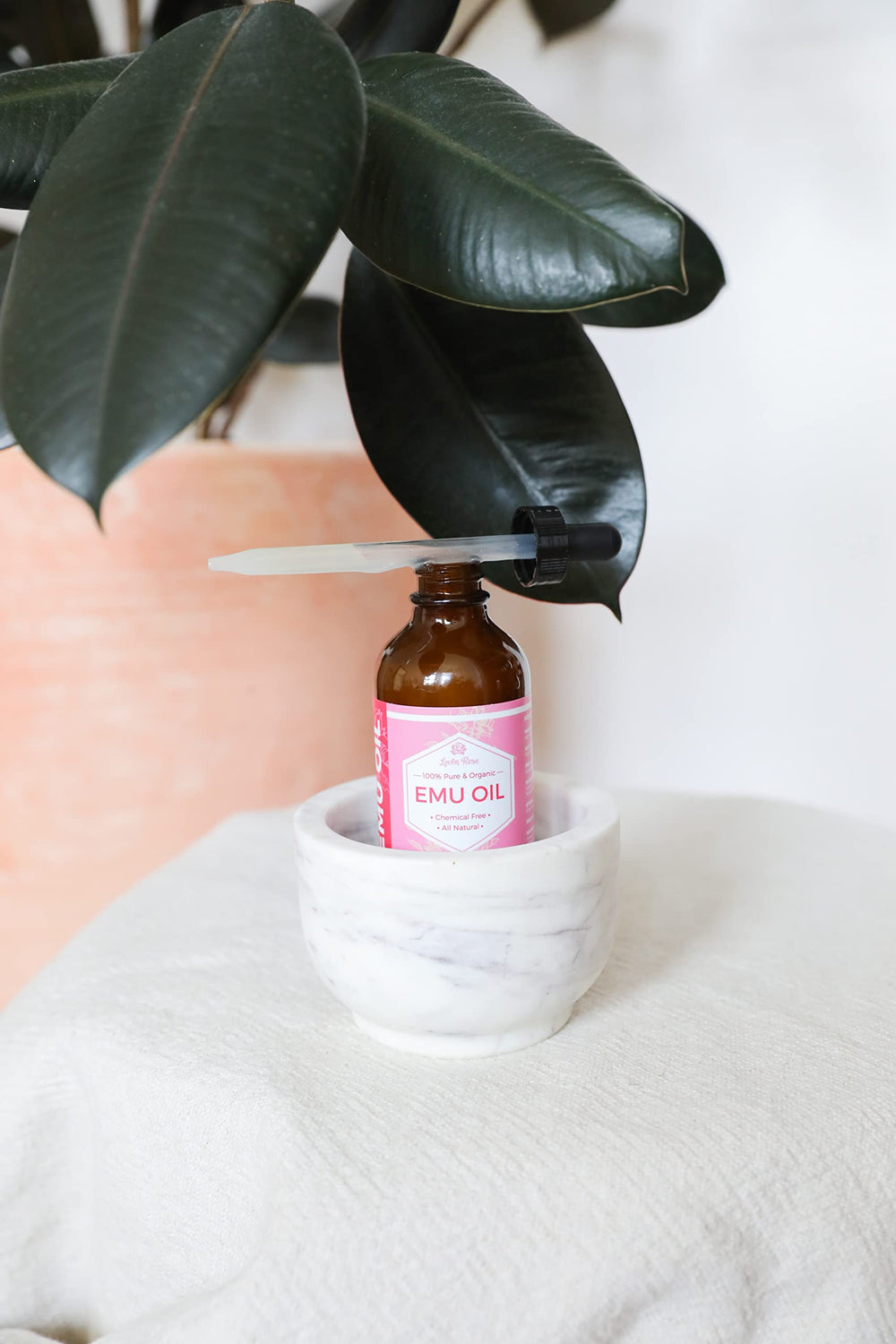 Leven Rose smoothing hair ends illustrating improved manageability and shine
