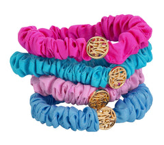 Lilly Pulitzer front view of four pink and blue satin scrunchies showing colors and packaging benefit
