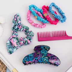 Lilly Pulitzer scrunchie worn on wrist as accessory offering on-the-go convenience