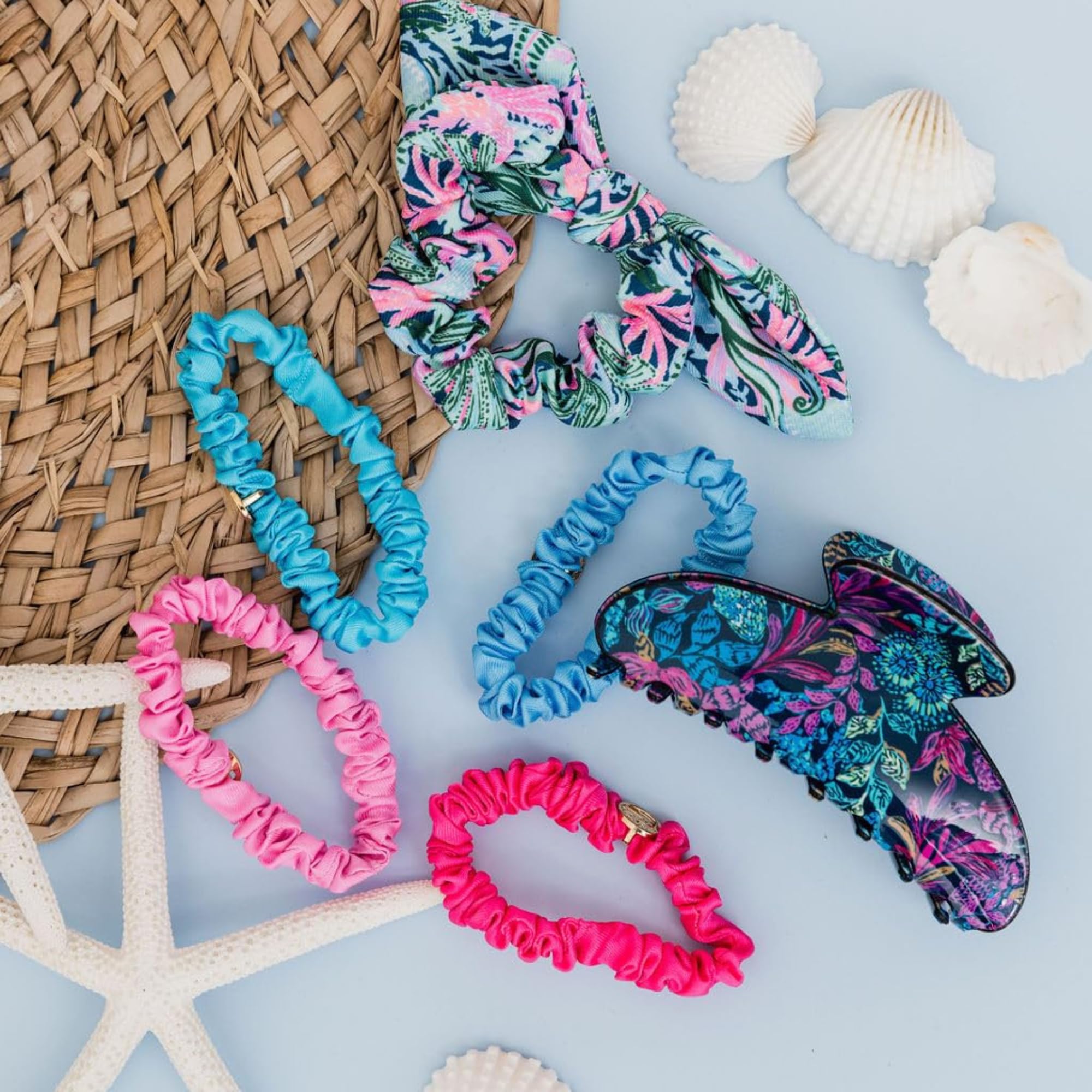 Lilly Pulitzer flat-lay of all four scrunchies highlighting coordinated pink and blue colorways