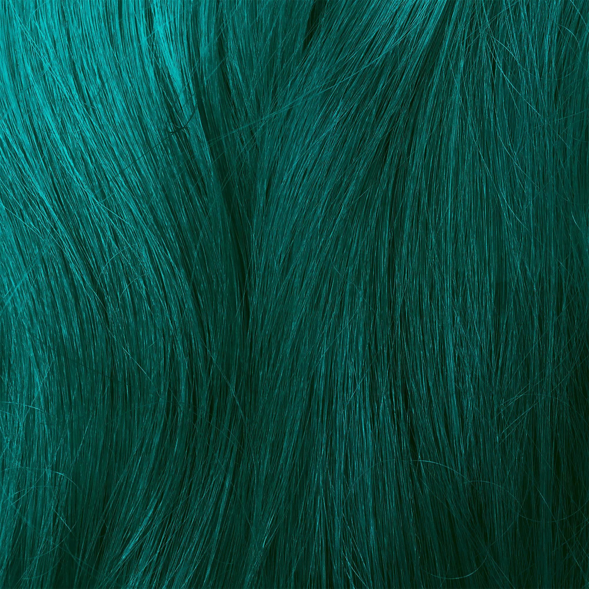 Lime Crime Sea Witch being applied in salon for even coverage and bold teal results