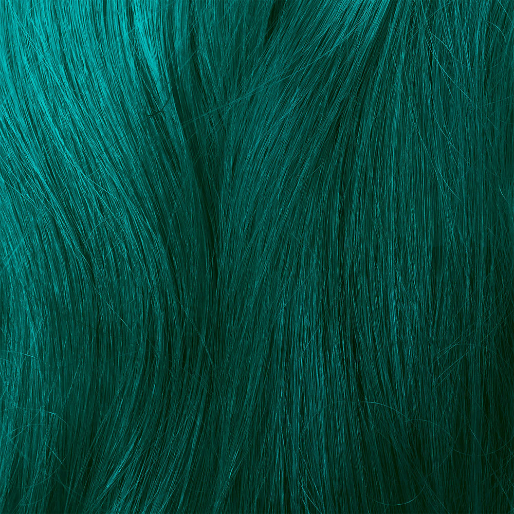 Lime Crime Sea Witch being applied in salon for even coverage and bold teal results