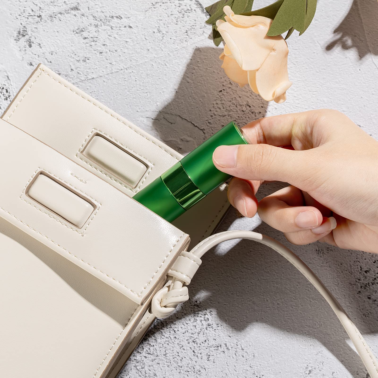 LISAPACK atomizer inside a purse illustrating convenient on-the-go refreshes
