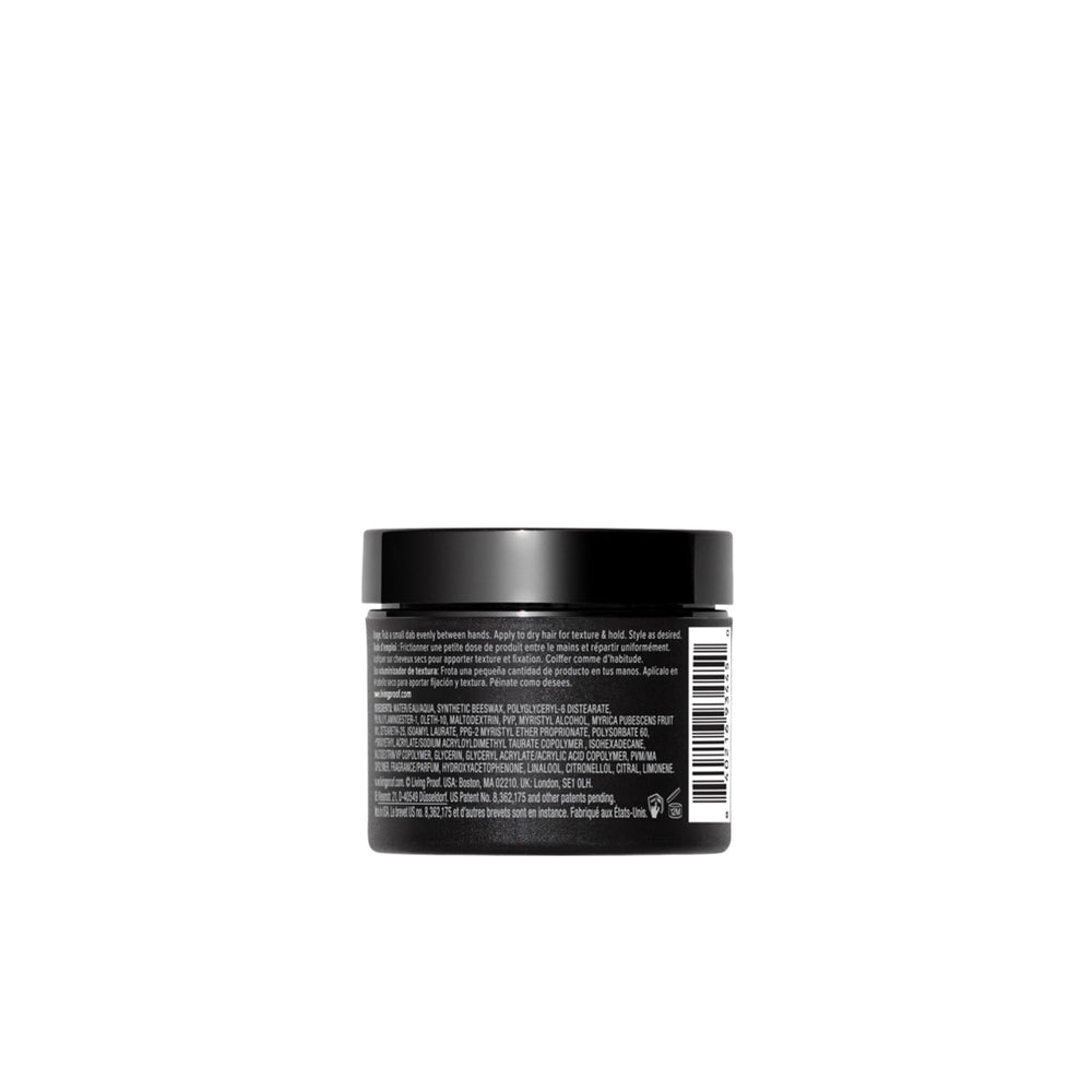 Living Proof Amp Texture Volumizer cream texture on hand, illustrating lightweight, buildable formula and touchable feel
