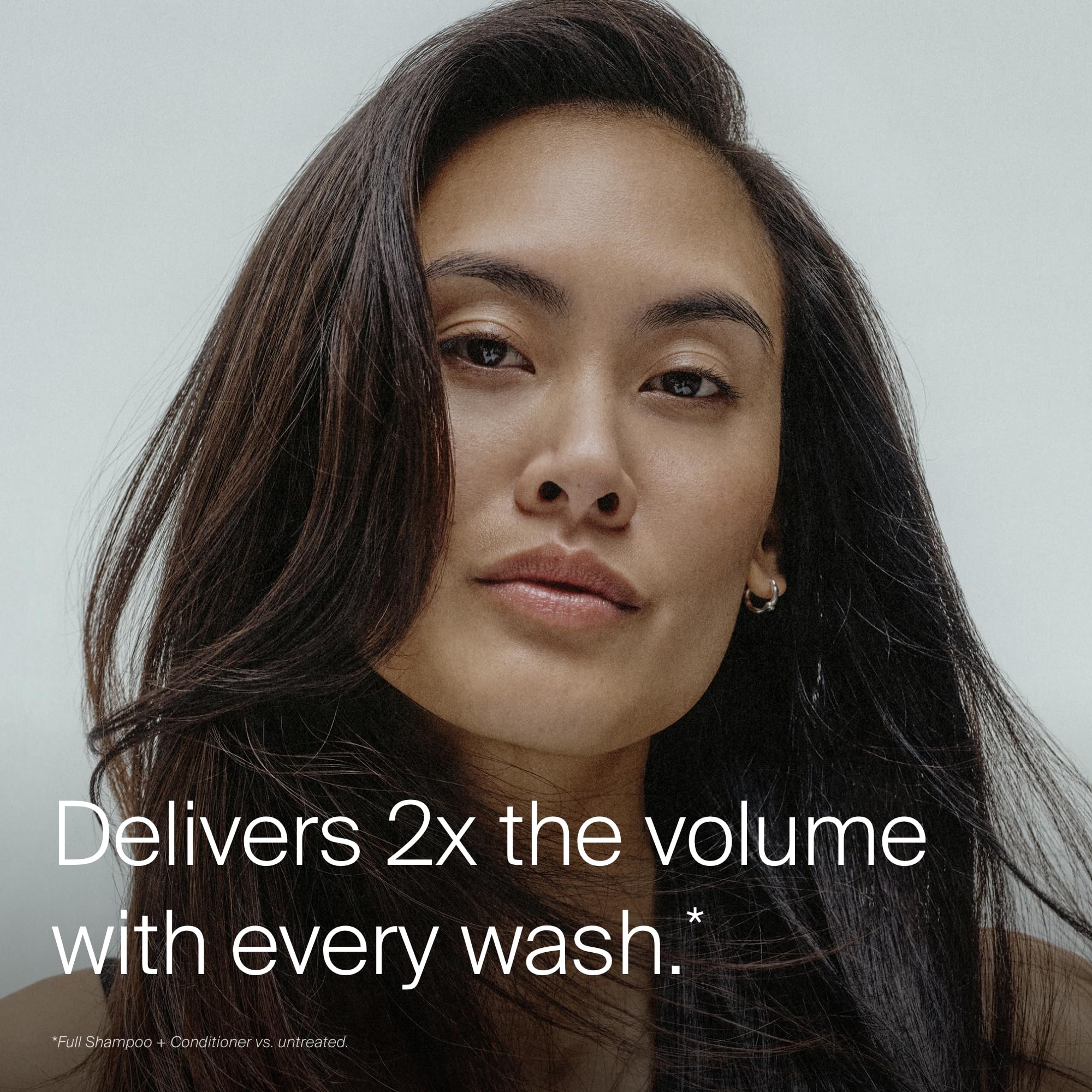 Living Proof conditioner cream close-up showing smooth texture for effortless detangling