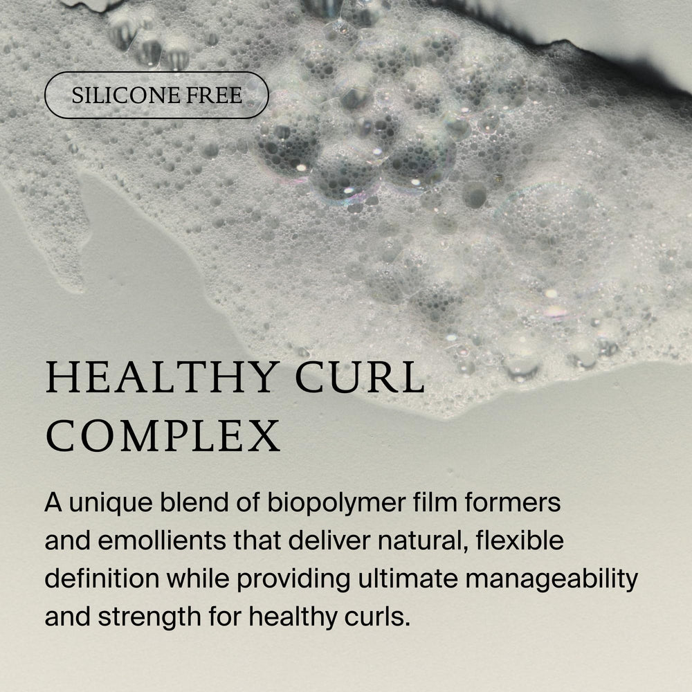 Living Proof label close-up highlighting strength and curl benefits