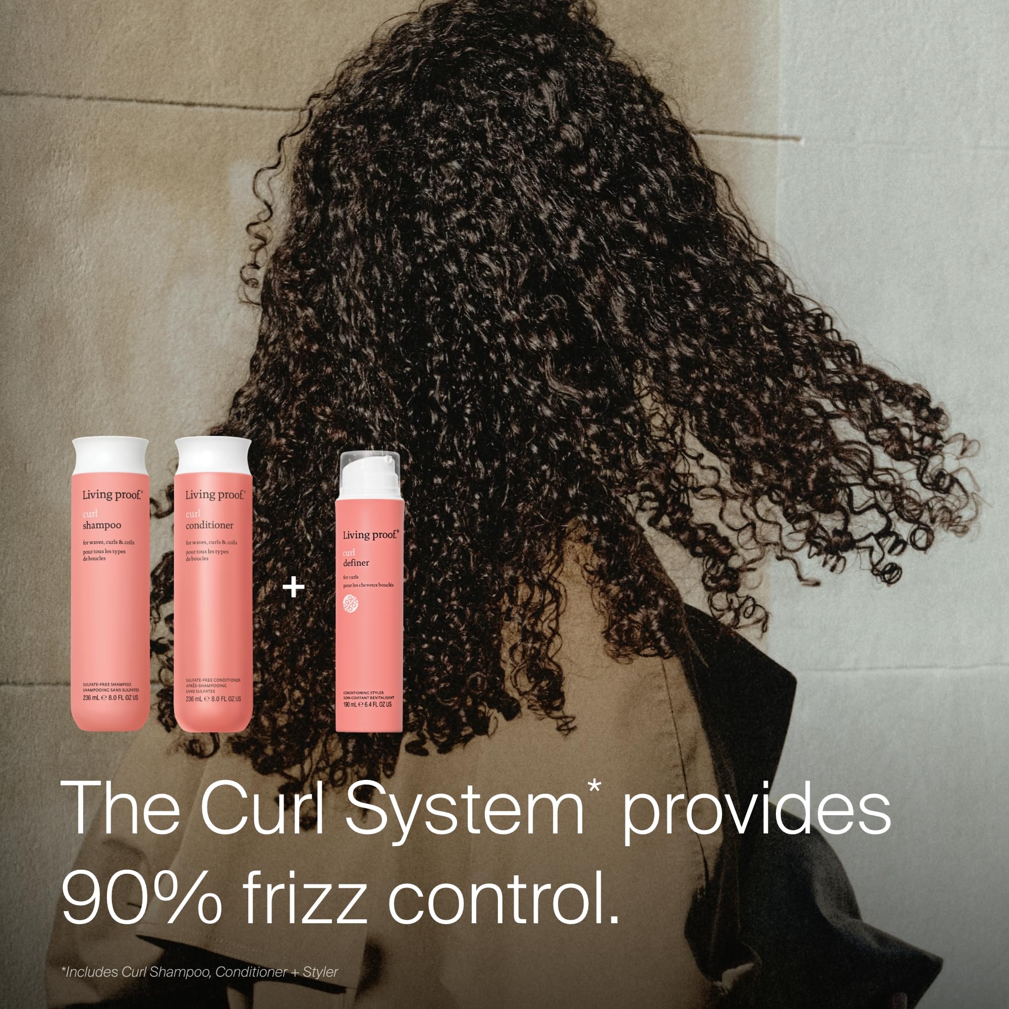 Living Proof shampoo applied to wet curly hair improving definition