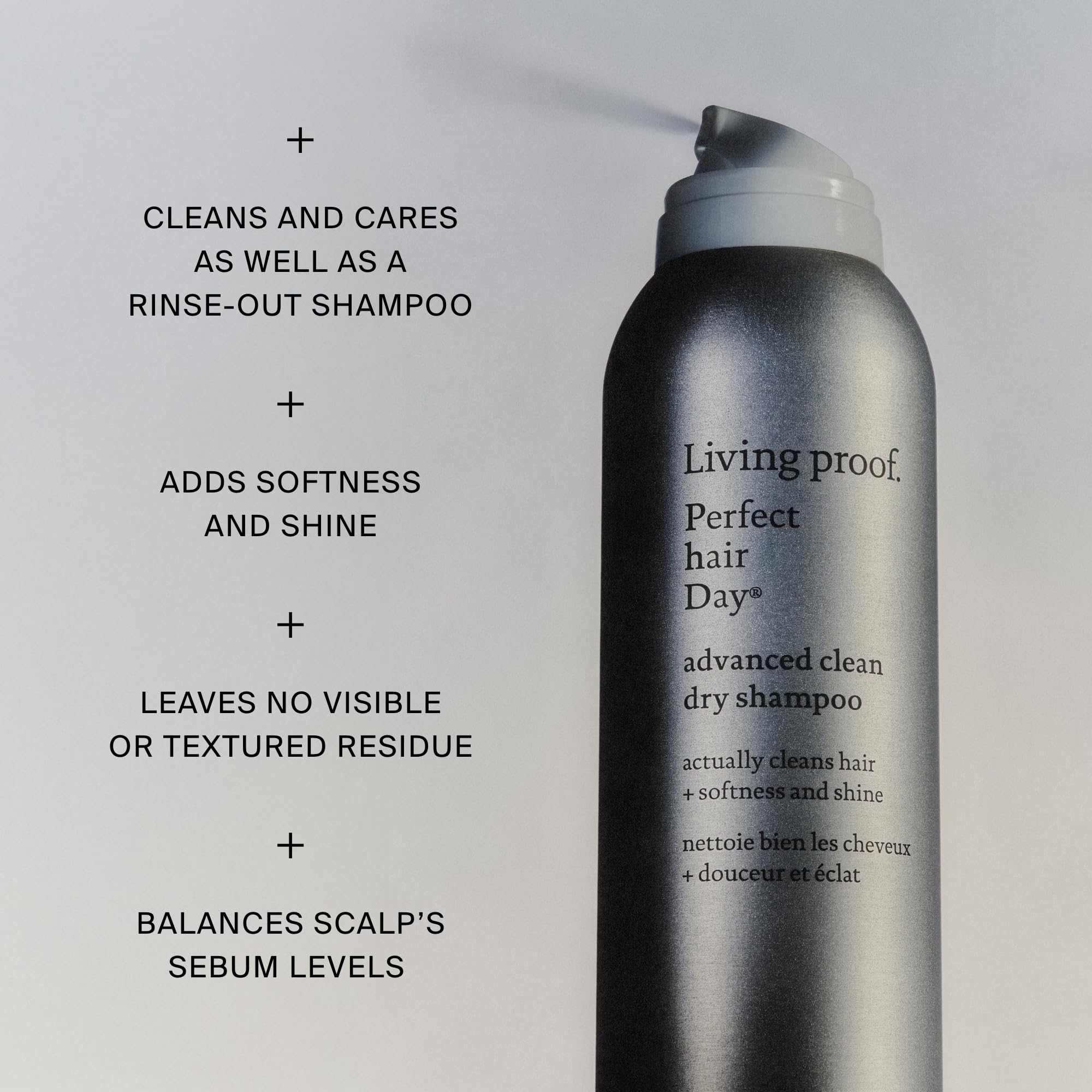Living Proof applying dry shampoo at roots for oil absorption