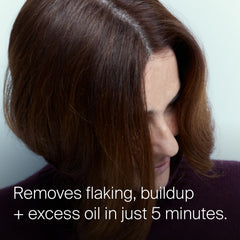 Living Proof serum texture on fingers illustrating lightweight spreadability