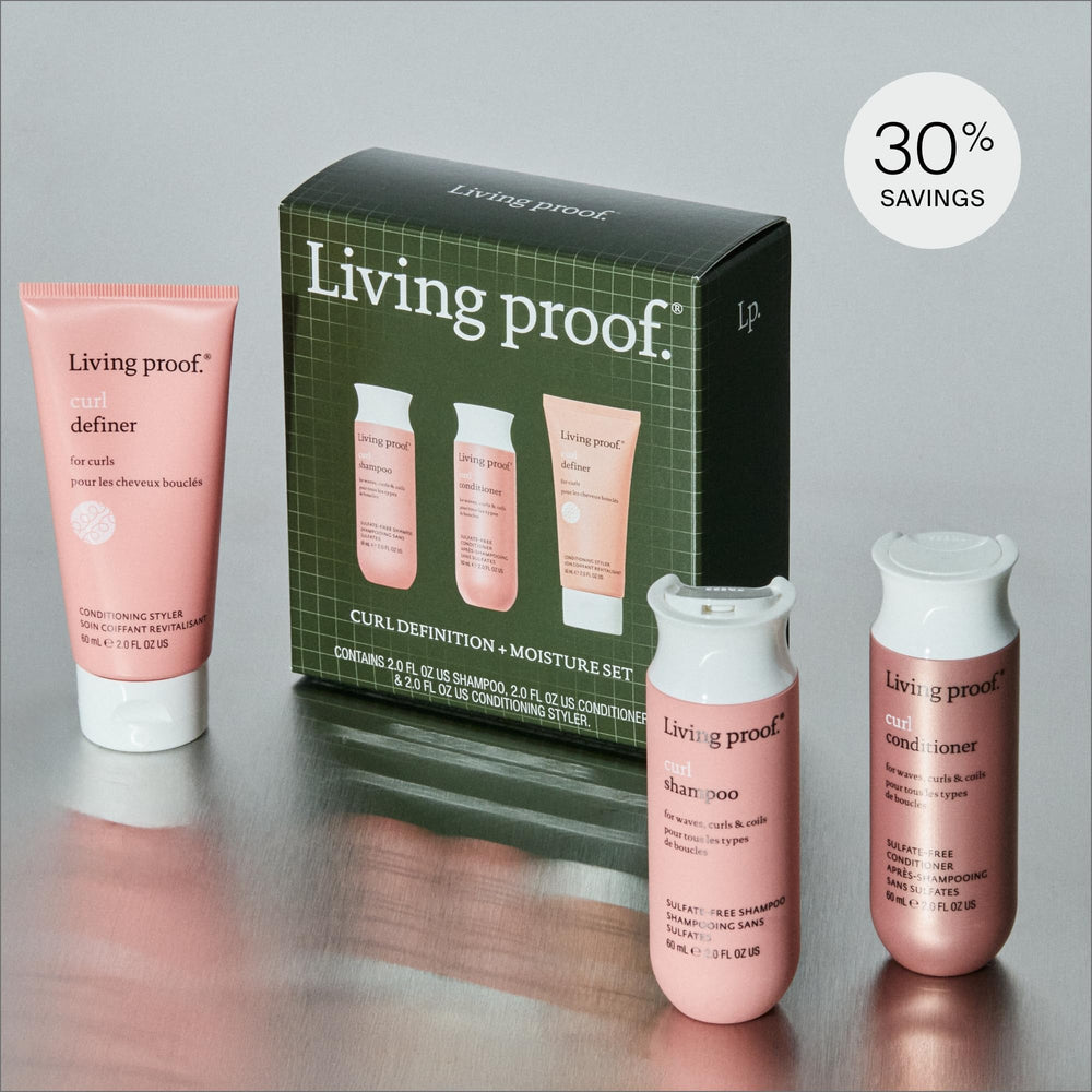 Living Proof Curl Shampoo and Conditioner bottles close-up for gentle cleansing