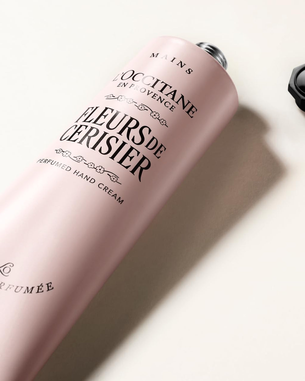 L'Occitane hand applying cream showing fast absorption and soft skin benefit