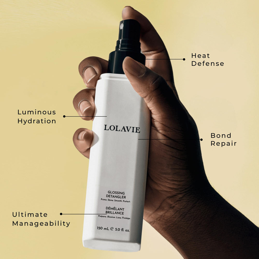 LolaVie mist spraying onto damp hair for quick detangling and slip