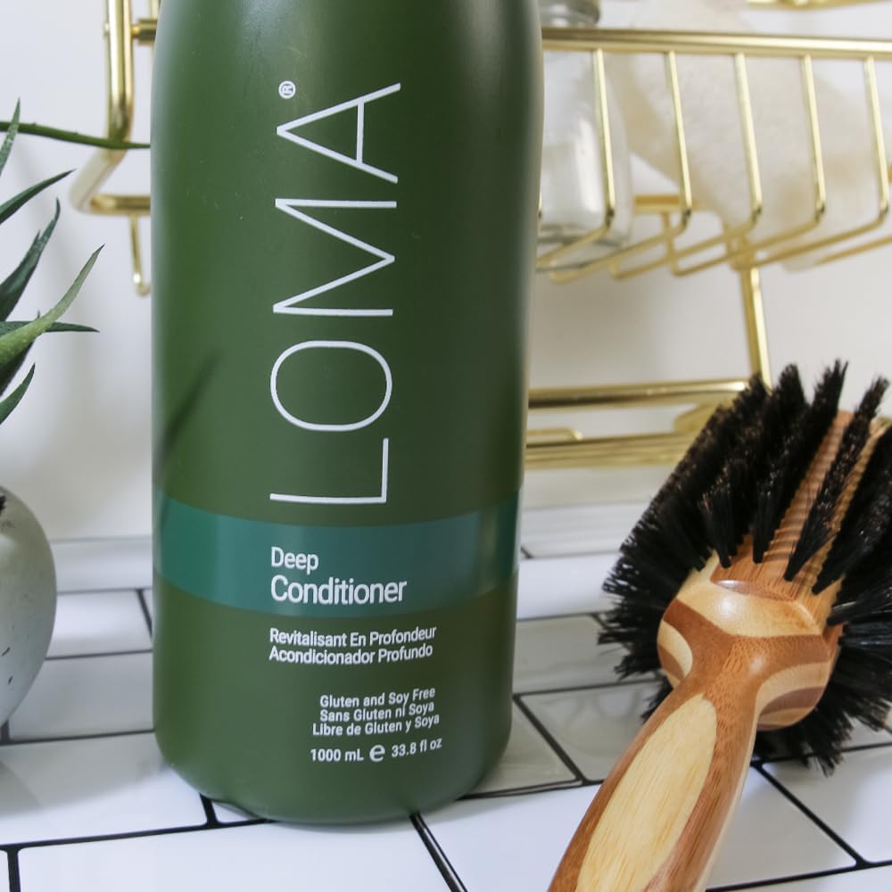 Loma deep conditioner beside a common shampoo bottle to show 33.8 oz scale advantage