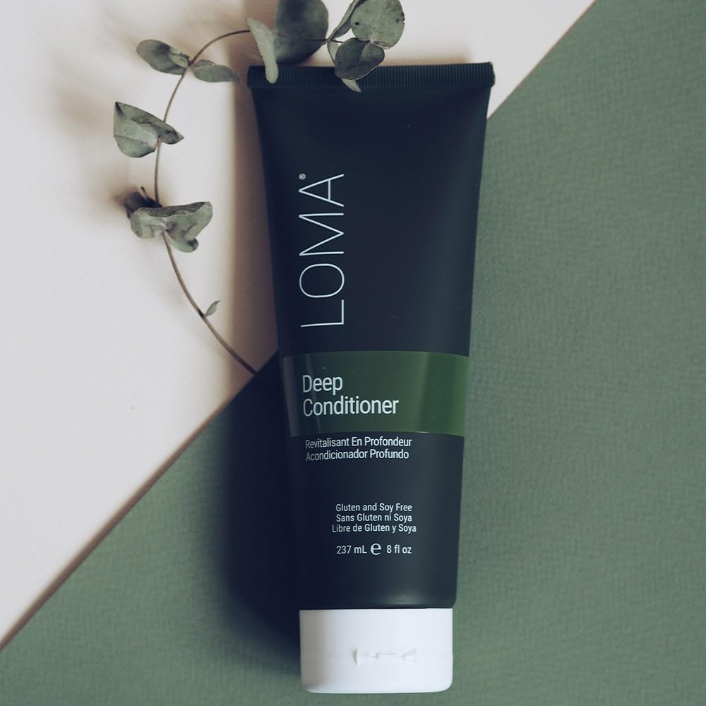 loma deep conditioner held in hand for scale emphasizing portable 8.45 ounce treatment