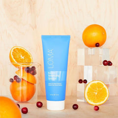 Loma styling in salon setting showing visible root lift and shine