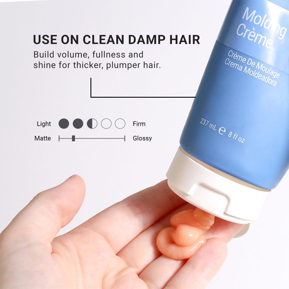 Loma molding crème in hand applied to damp hair demonstrating easy distribution benefit