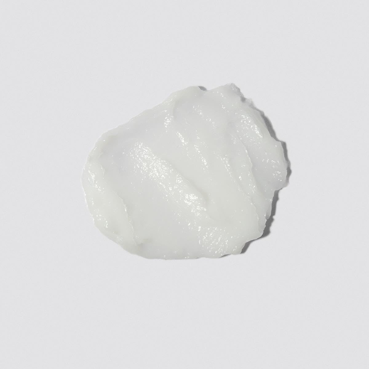 Loma smoothing crème texture close-up demonstrating lightweight sheen and spreadability
