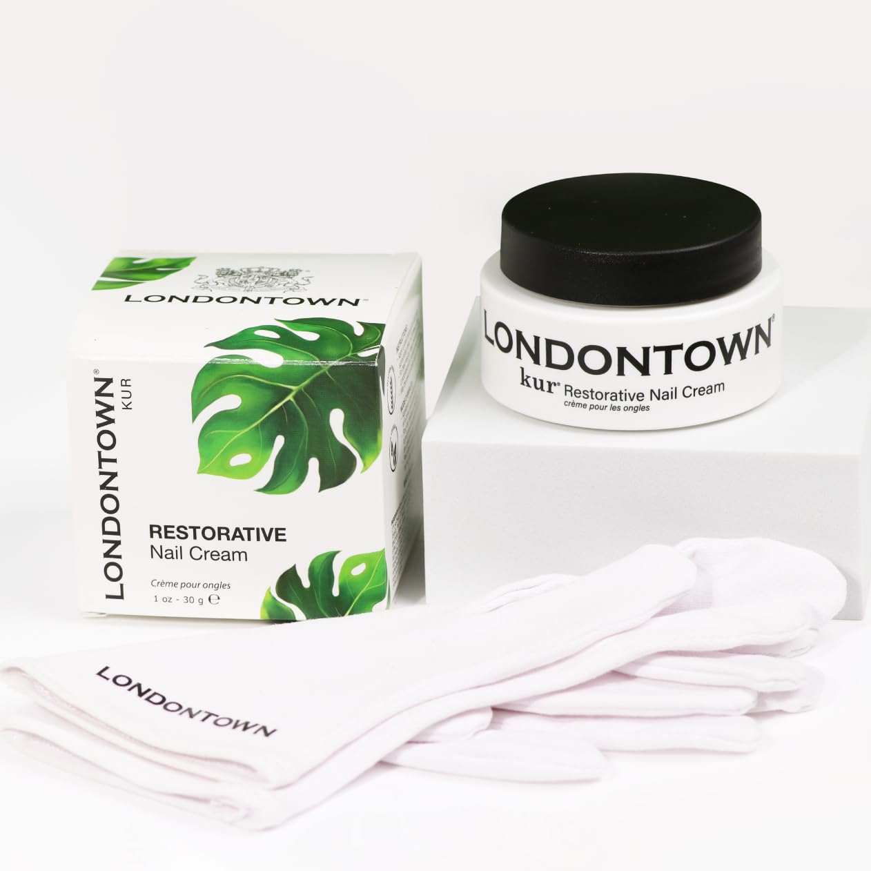 LONDONTOWN jar beside hand for size and practical use benefit