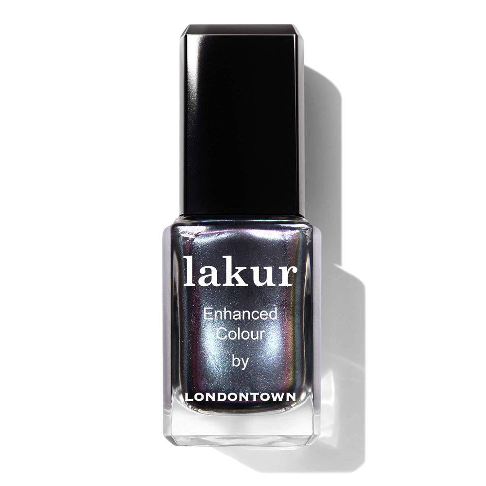 LONDONTOWN lakur next to a coin showing bottle scale and travel-friendly size benefit
