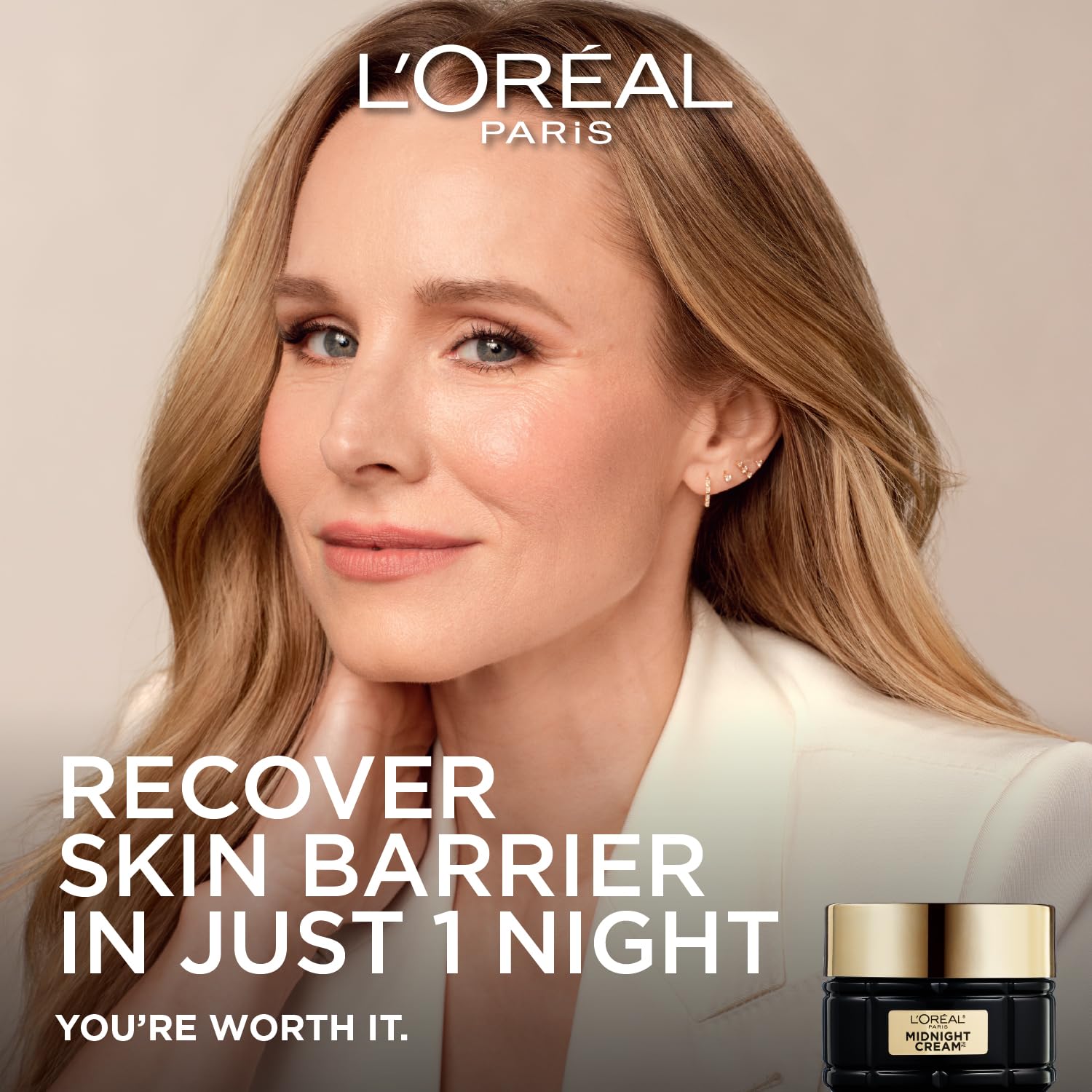 L'Oreal Paris jar opened revealing cream texture and restorative night benefit