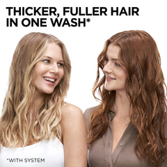 L'Oreal Paris conditioner being applied to wet hair showcasing smooth detangling and instant root lift benefit